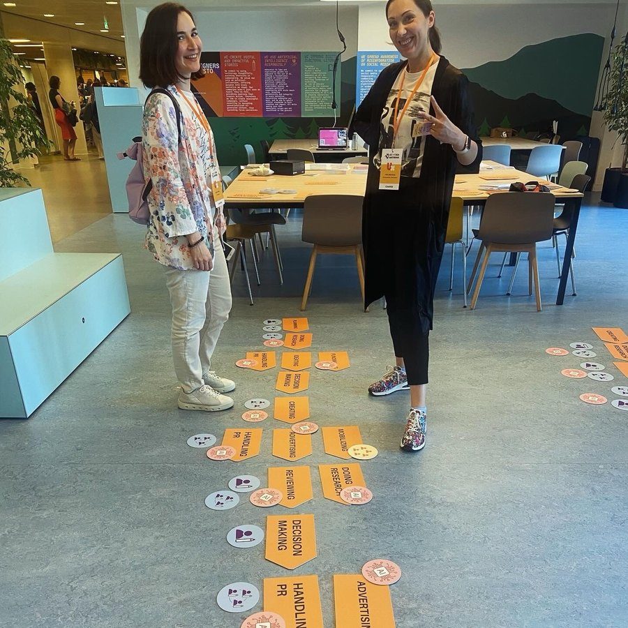 Posing with life-size floor game